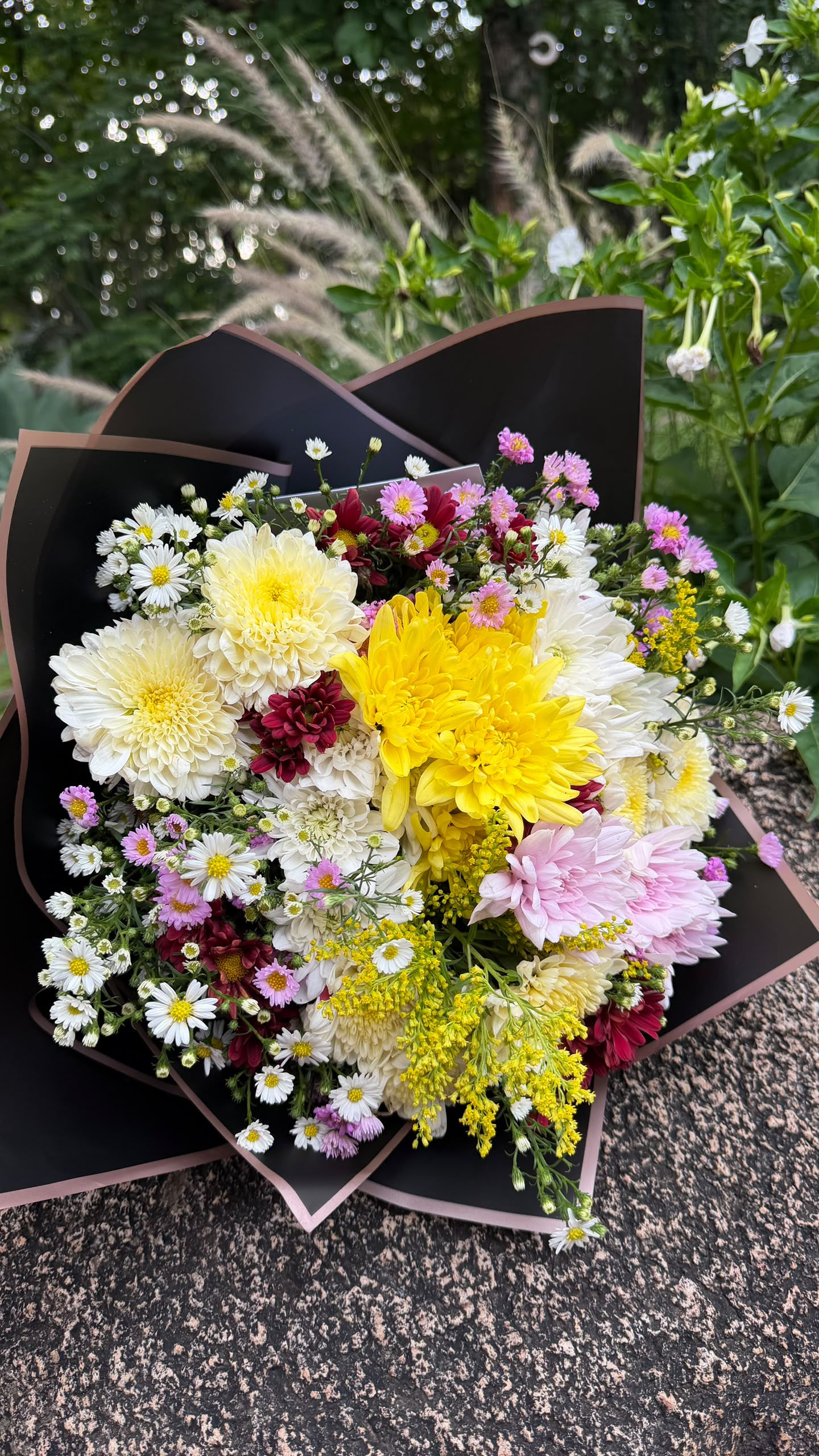 Pastel mixed bouquet of chrysanthemums and daisies