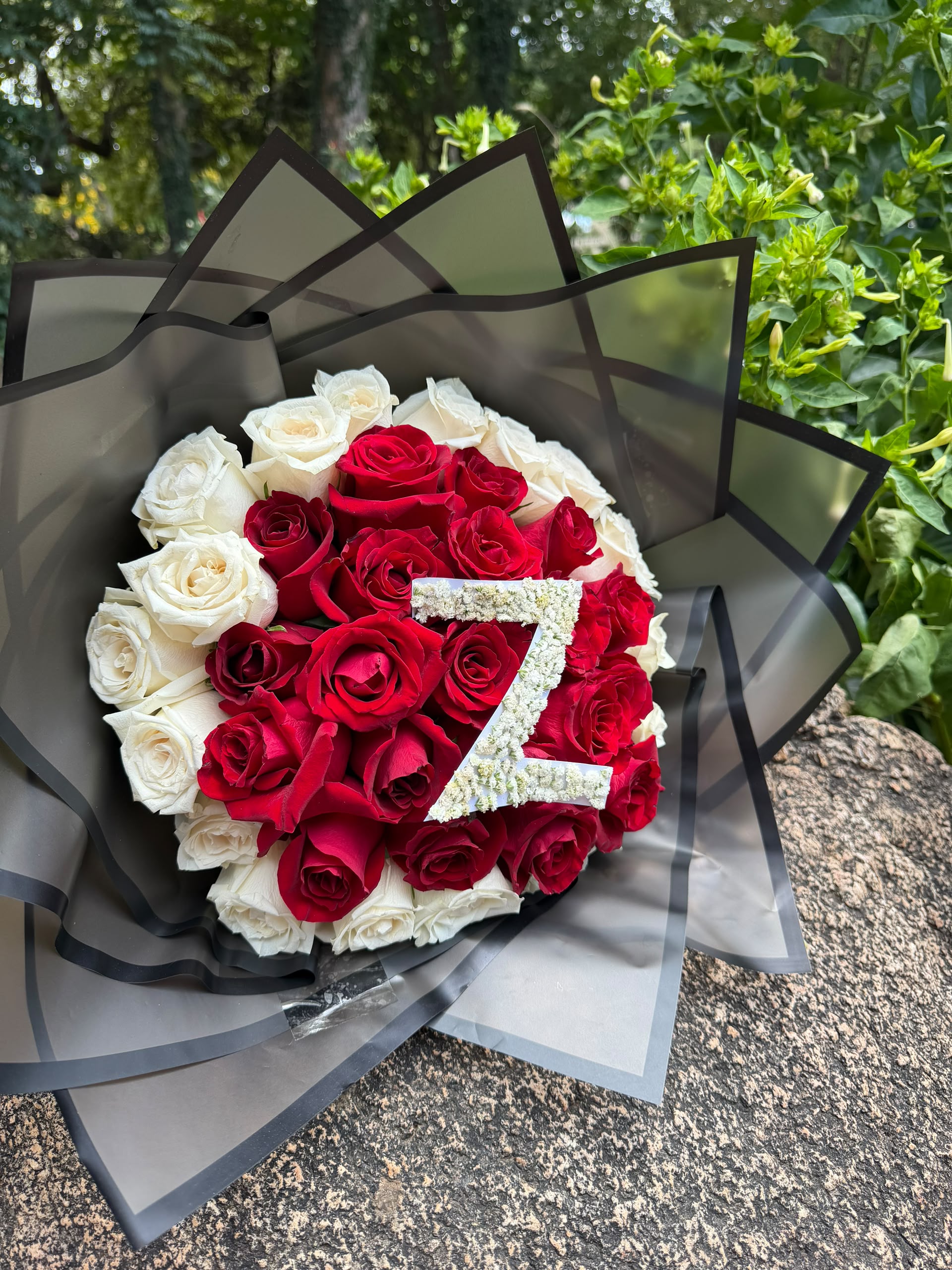 Hot pink rose bouquet with baby's breath